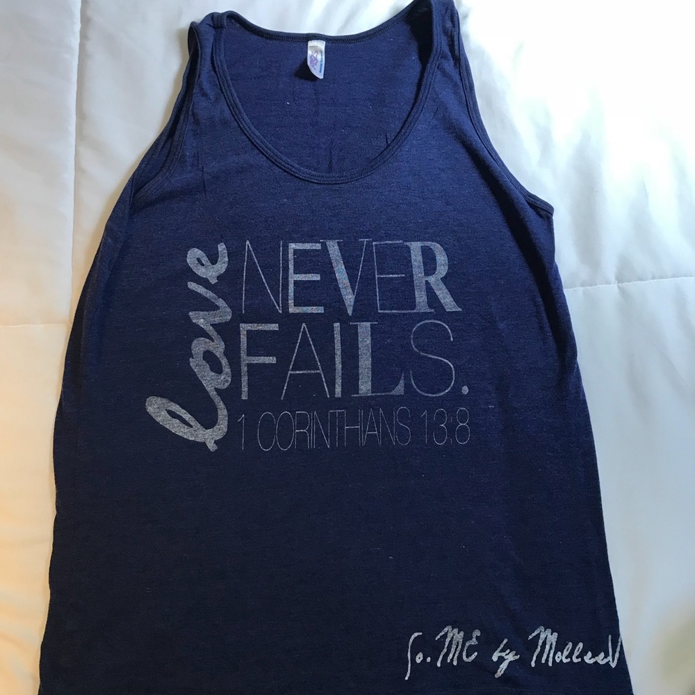Love Never Fails tank. Size small. Good condition.